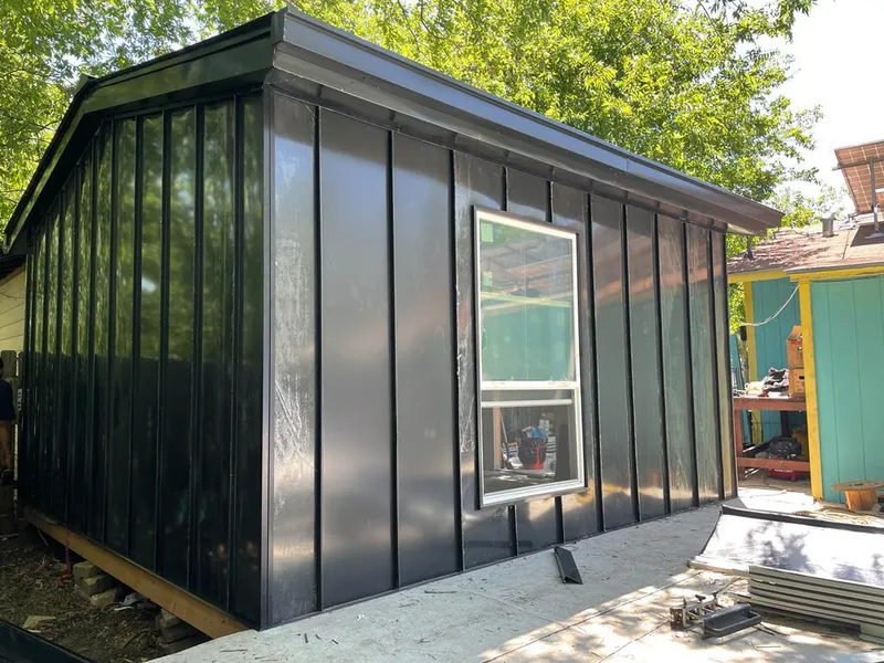 Black standing seam metal wall panels for Roof Inspection in New Garden